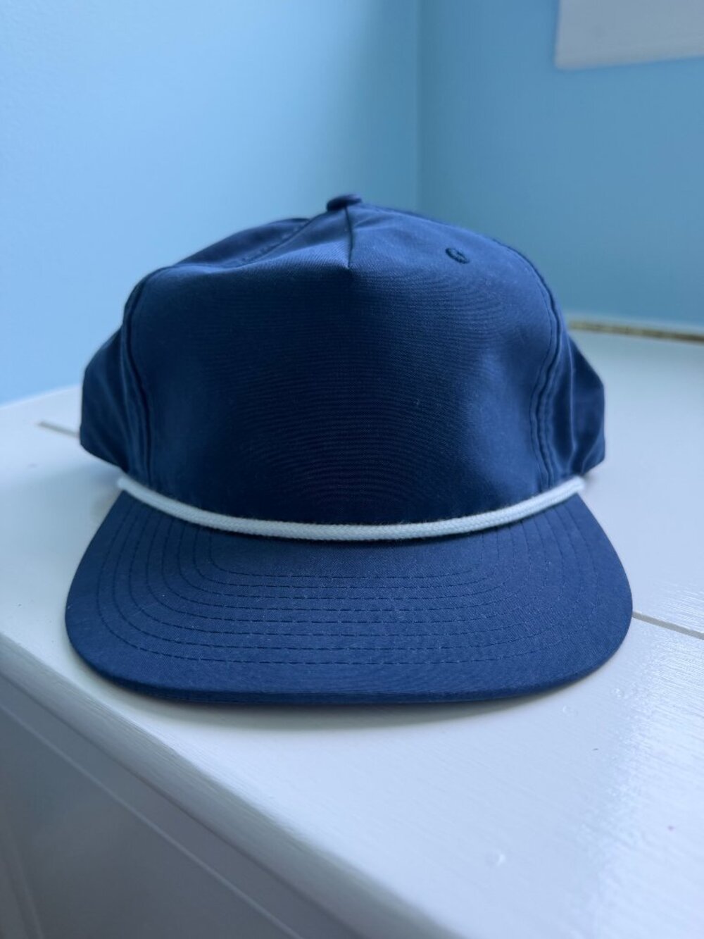 Blue Hat with White Rope Trim